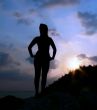 Silhouette of a girl against the sunset