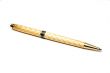 Gold ball-point pen. Isolated on a white background.
