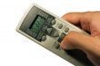 Conditioner remote control in the hand.