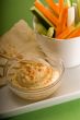 hummus dip with pita bread and vegetable