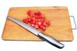 slices of tomatoes and a knife on a chopping board