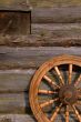 Spinning Wheel On The Log Hut Wall