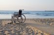 Wheelchair on sandy seacoast