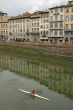 Kayaker on River Arno in Florence, Italy
