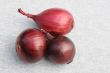 Three Red Onion Bulbs