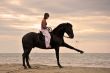 girl and  horse on the beach