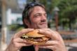 man and hamburger