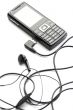 Black mobile phone isolated on white close up