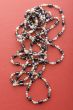 costume jewel beads on red macro