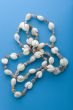 costume jewellery beads on blue