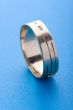 Gold ring on blue background macro