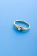Gold ring on blue close up