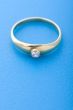 Gold ring on blue macro