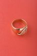 Gold ring on red