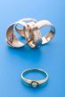 Gold rings on blue