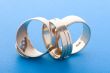 Gold rings on blue background