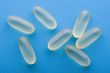 Medical pill on blue background