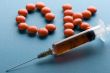 Medical Tablet and syringe close up