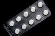 Medical tablet on black macro