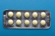 Medical tablet on blue close up