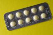 Medical tablet on yellow