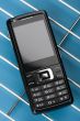 mobile phone on blue macro