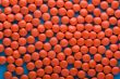 Red Tablet on blue close up