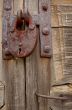 Padlock And Handle On Wooden Gate