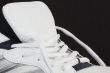 Trainer showing laces