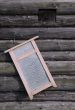 Washboard on Old Log House Wall