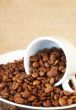 Cup filled with coffee beans