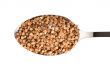 Buckwheat in a spoon isolated