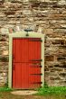 Red door on a old stone building