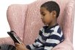 Young boy studying on a tablet PC