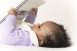 Baby reading a book