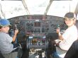 two boys in a cockpit