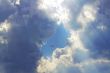 blue sky framed by clouds