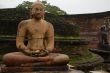 Seated Buddha Statues In The Rain
