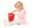 Little girl looking in gift bag