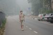 Woman Walking in Thick Smog