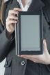 Girl holding an electronic book reader