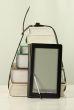 Stack of books and electronic book reader