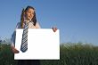 Teen girl holding white poster