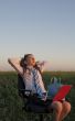 Teen girl sitting with a laptop