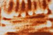 Rust on the painted metal surface