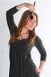 The girl the visagiste in a gray dress