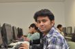 Adult professional in computer class