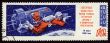 Postage stamp with soviet Cosmonaut Aleksei Leonov in space