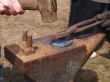 Making a horseshoe on an anvil in the forge