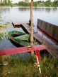 red wooden  bench  with a fishing rod